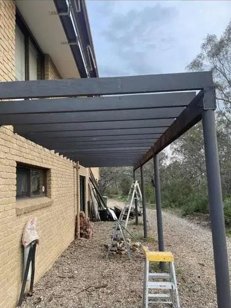 Steel posts and beams for an upper level balcony