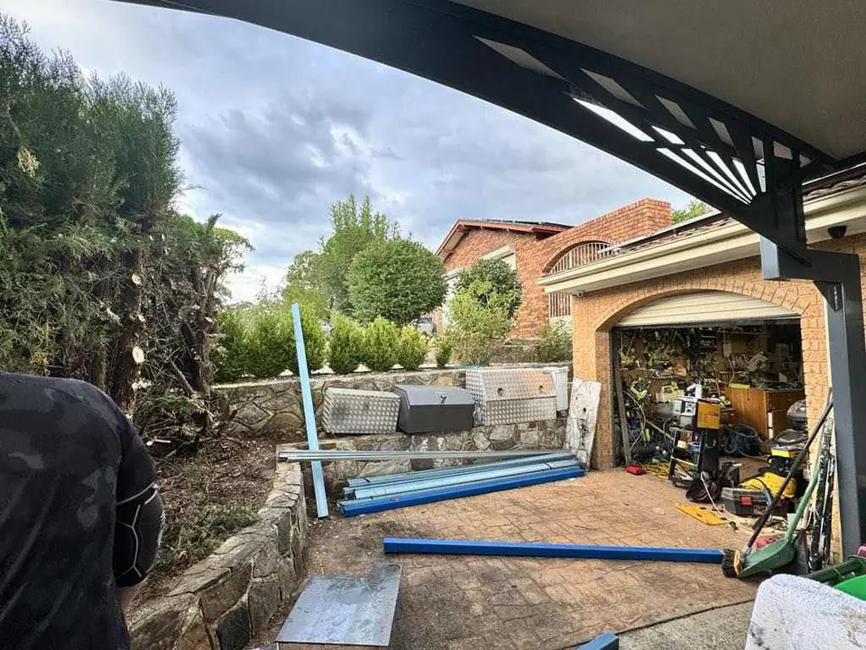 Workshop frame going up beside a garage