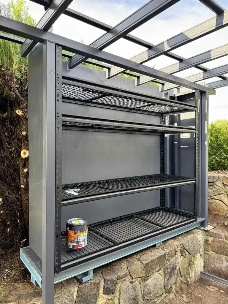 Steel shelving built into an outdoor workshop